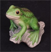 A porcelain figurine of a frog marked Boehm,