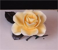 A porcelain rose figurine by Boehm with original