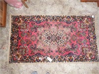 Lot #148 - Floral wool pile scatter rug (25 x48)