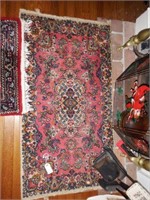 Lot #130 - Floral rug (26” x 48”)