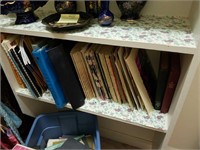 Shelf and tote of old sheet music and music books