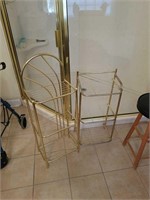 2 brass like shelving units with stool