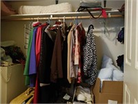 Closet contents clothes, purses, suitcase