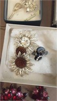 Assorted brooches and earrings