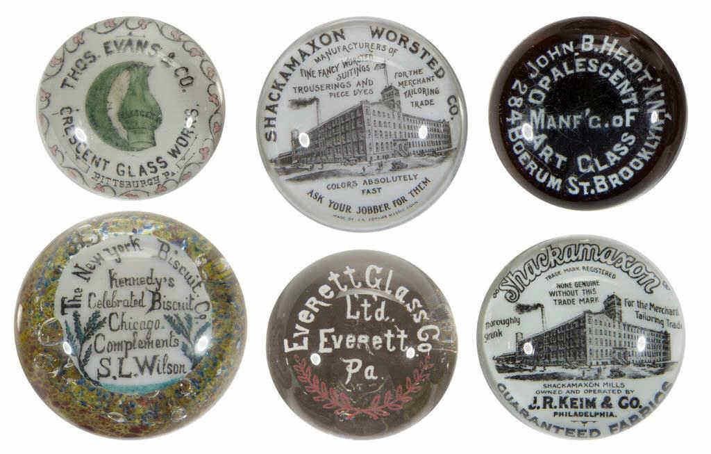 Large selection of advertising paperweights