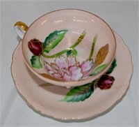 3 Footed Occupied Japan Tea Cup & Saucer