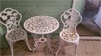 Wrought iron parlor table and chairs