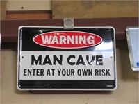 Metal Man Cave "Warning" Sign