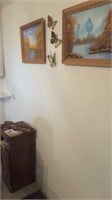 Two paintings and butterflies on wall, telephone