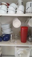 Contents of middle  kitchen cabinet including