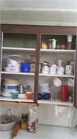 Contents of middle  kitchen cabinet including