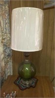 end table with lamp, picture and bird