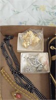 Box of costume jewelry including Rose Colored