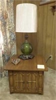 end table with lamp, picture and bird