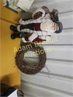 19 inch resin Santa with grapevine wreath