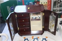 Jewelry cabinet with drawers.
