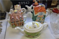 Five novelty teapots.