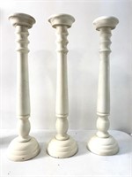 Three wooden candle holders