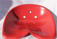 BRIGHT RED METAL TRACTOR SEAT