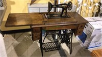 Antique Singer sewing machine, treddle style, with