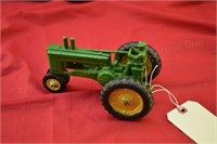 Early John Deere Model A Tractor with Man