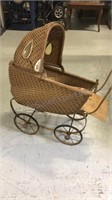 Antique wicker and metal child’s doll stroller
