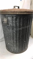 Vintage galvanized metal garbage can with lid