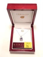 14K White gold emerald cut tanzanite pendant with
