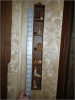 Vintage miniature figures in wall hanging