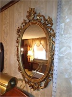 Decorative gold colored wall mirror