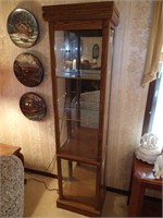 Lighted oak curio cabinet