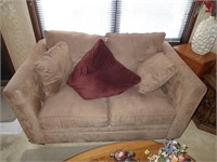 Tan upholstered sofa