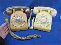 2 vintage off-white rotary dial telephones