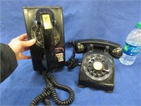 2 vintage black rotary dial telephones (1 wall)