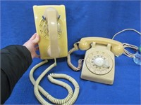 2 off-white rotary dial telephones (1 wall)