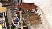 Pair of vintage 42 inch snow sleds one has street