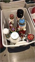 Tote with lid and has eight nutcrackers in it