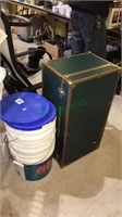 Footlocker and 35 gallon bucket and two lids,
