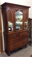ANTIQUE  CARVED PRESS ON CHEST WITH BEVELED MIRROR