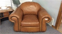 BROWN LEATHER OVERSIZED CHAIR WITH NAILHEAD TRIM