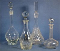 Four varius cut crystal & etched glass decanters