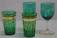 Two Victorian stemmed green glasses