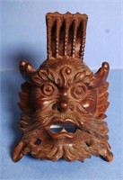 Eastern wood carving of a deity