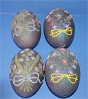 Four vintage hand decorated emu eggs