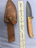 Knife 7.5" long with wood handle and leather sheat
