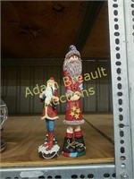 Two decorative resin Santa Claus figurines