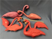 About 7 pink flamingo yard items       (k 96)