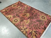 RED EMBROIDERED AREA RUG