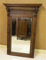 Neo Renaissance Style Carved Oak Beveled Mirror.
