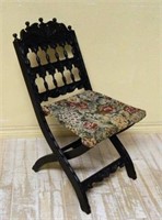 Victorian Relief Carved Ebonized Campaign Chair.